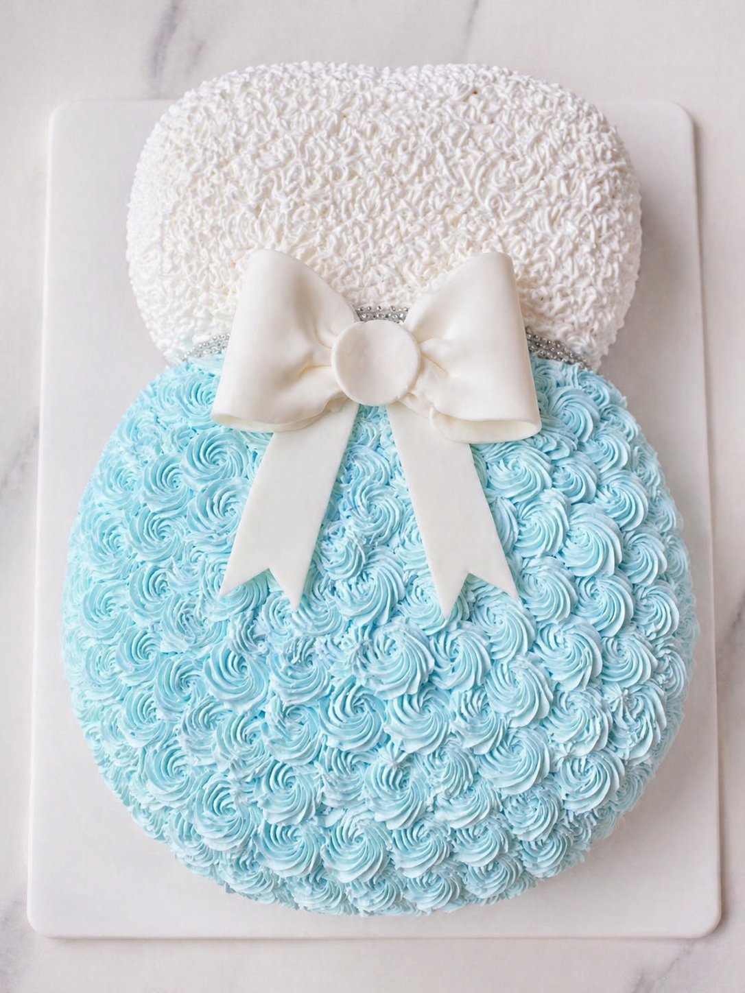 Pastel de baby shower sonajero azul
